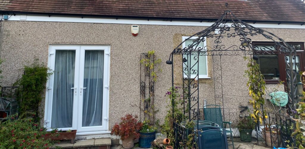 New white UPVC fascia, soffit and black guttering fitted to the rear of a Chingford property after roofline upgrade.