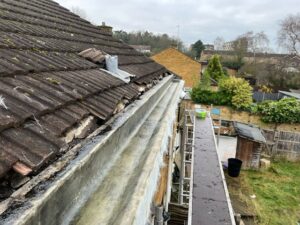 Concrete gutter after priming, preparing the surface for fibreglass lining to be applied.