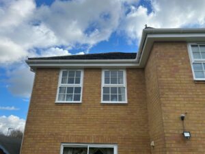 Close-up of white uPVC guttering and soffit fitted on a corner section of the property in Bishops Stortford