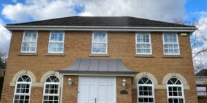 Front view of a home in Bishops Stortford with new white uPVC fascia, soffit, and guttering installed by SM Roofline