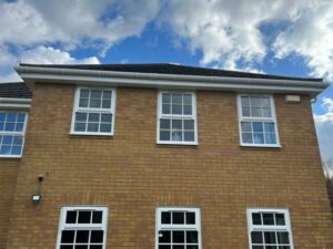 Rear view showing new fascia, soffit and guttering in white uPVC installed at a property in Bishops Stortford