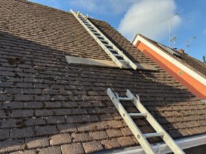 Main roof cleaned of moss, tiles clear and even after work completed in Old Harlow.