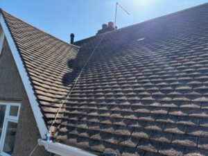 Roof ridge and tiles looking clean and clear after moss removal in Old Harlow.