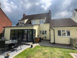 Black half round guttering and white fascia fitted to side extension in Braintree