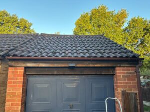 Garage with old fascia soffit and guttering before replacement