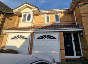 Wide view of property front before roofline replacement in Elsenham