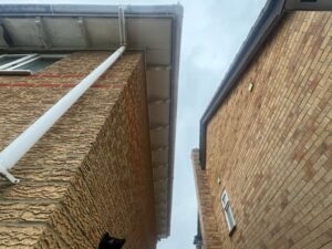 Side of property before new fascia soffit and guttering installation