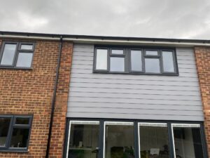 Rear elevation after new fascia, soffit, guttering and cladding installation in Ware