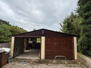 Garage front with completed EPDM roofing system