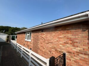 Side elevation of bungalow showing original fascia, soffit and guttering before replacement