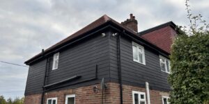 New black external cladding installed to a property in Matching Tye