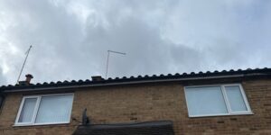 Front of a Harlow property with replacement white fascia and black guttering