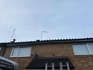 Existing front roofline at a Harlow property before fascia, soffit and guttering replacement