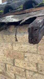 Exposed timber at the roof edge after the existing roofline boards were removed